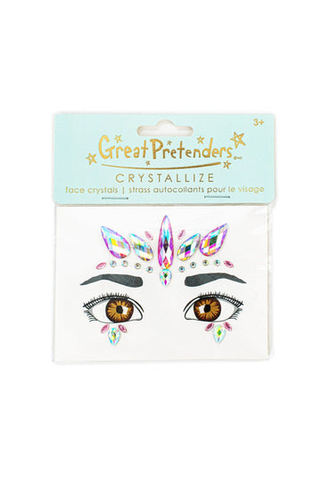 Envase de cristales adhesivos para la cara con joyas rosas y turquesas sobre unos ojos dibujados